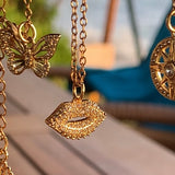 Stainless Steel gold plated smooches rhinestone lip Necklace
