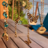 Stainless Steel gold plated smooches rhinestone lip Necklace