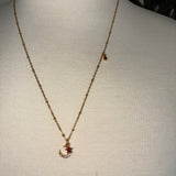 Stainless Steel gold plated rhinestone bedazzled crescent moon lightening rod and garnet red crystal star Necklace