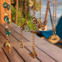 Stainless Steel gold toned Pretty little baby blue Flower Necklace