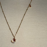Stainless Steel gold plated rhinestone bedazzled crescent moon lightening rod and garnet red crystal star Necklace