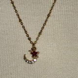 Stainless Steel gold plated rhinestone bedazzled crescent moon lightening rod and garnet red crystal star Necklace